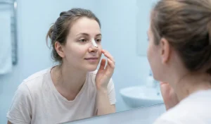 rhinoplasty patient mirror reflection
